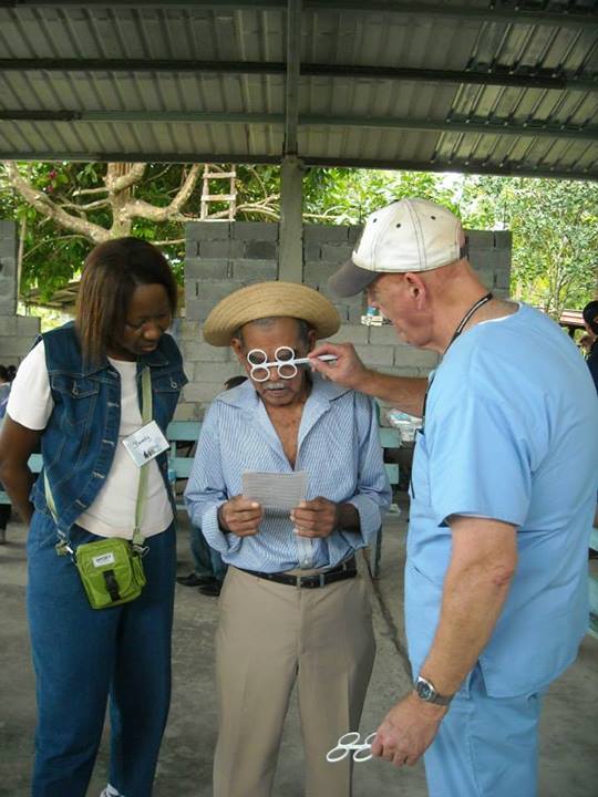 an older man having a simple eye test for glasses