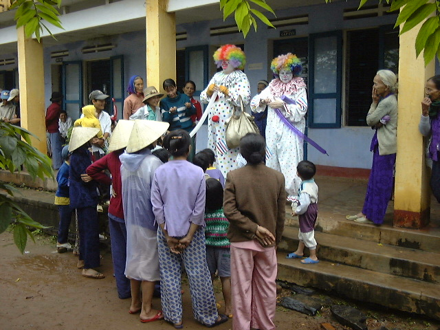 clowns entertain Vietnamese people 