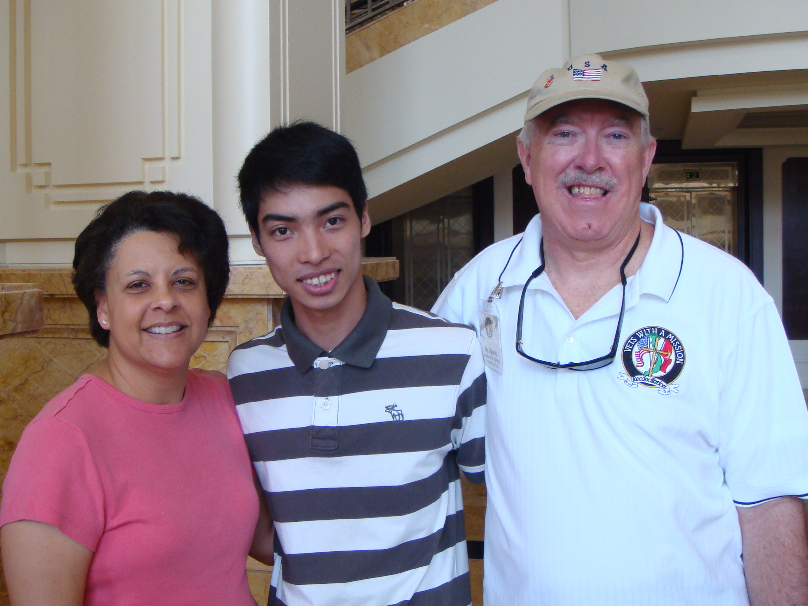 3 people, a man and wife with a young man 