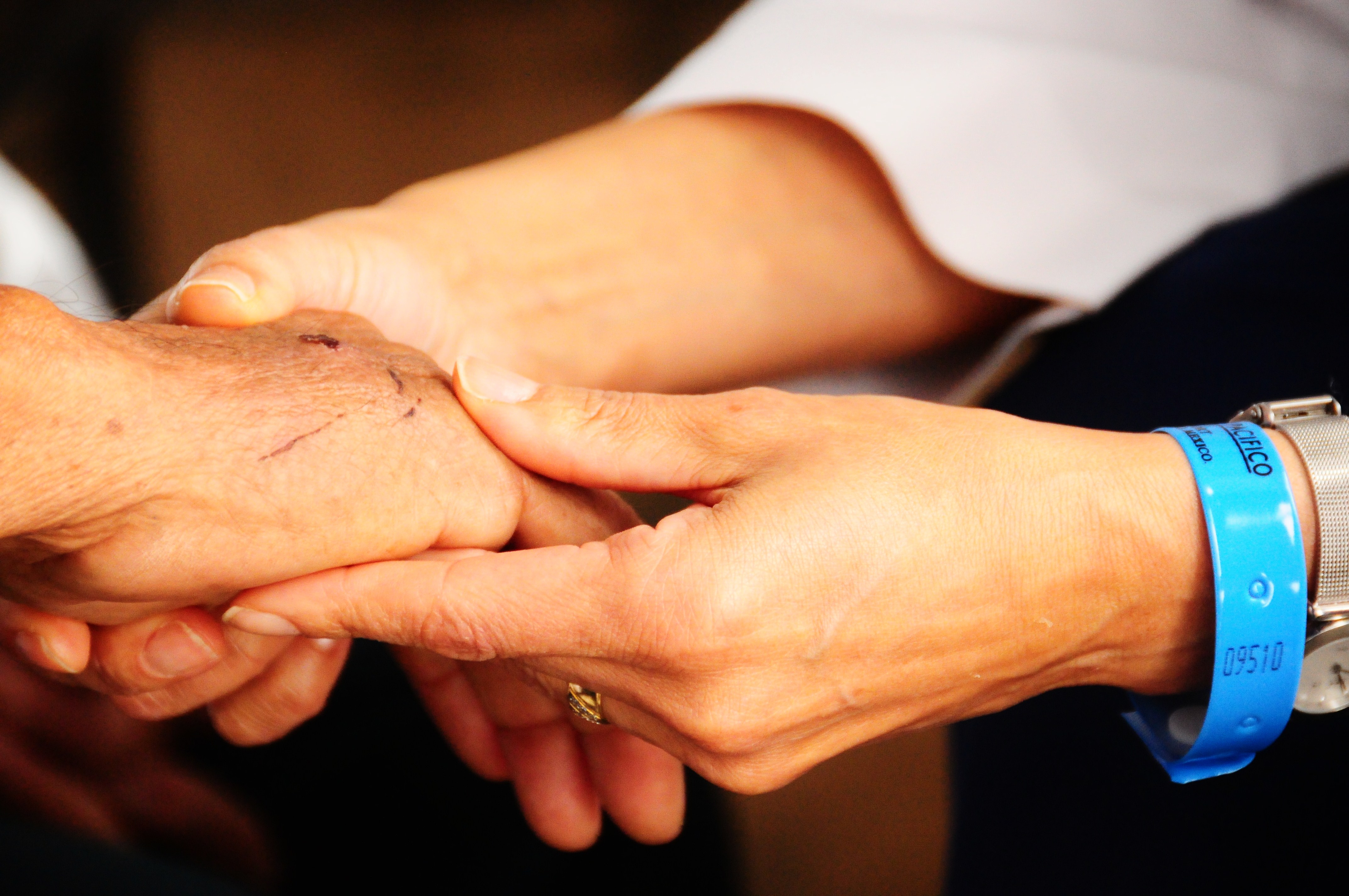 doctor holding a patient's hand