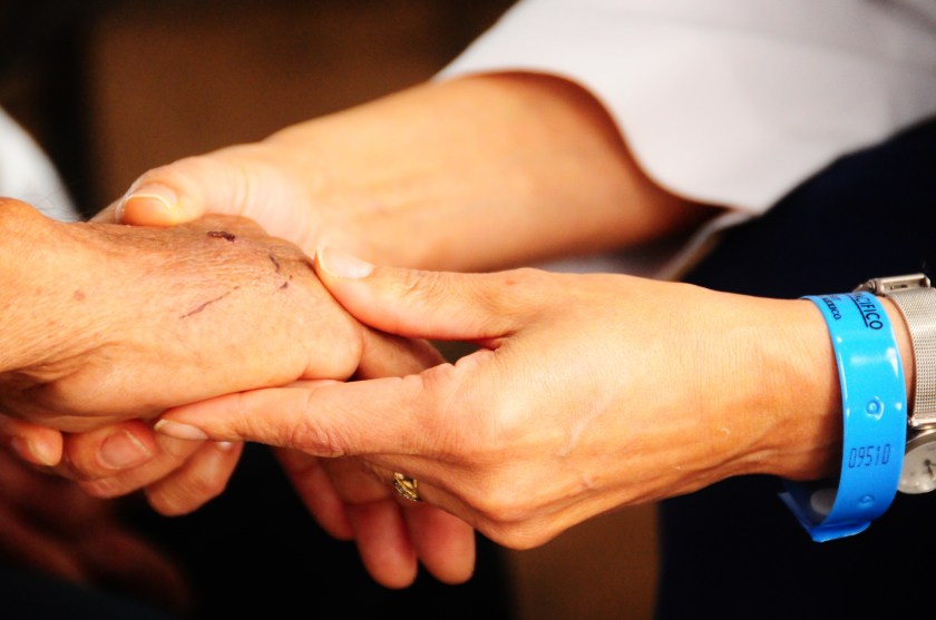 doctor holding a patient's hand