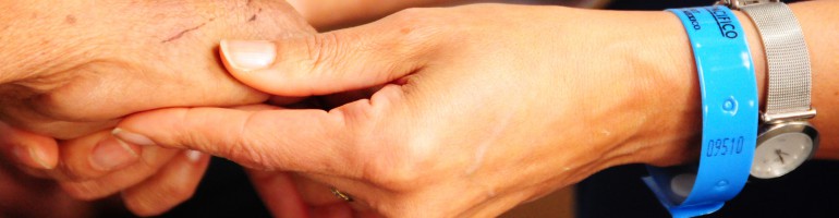 holding the hands of a patient