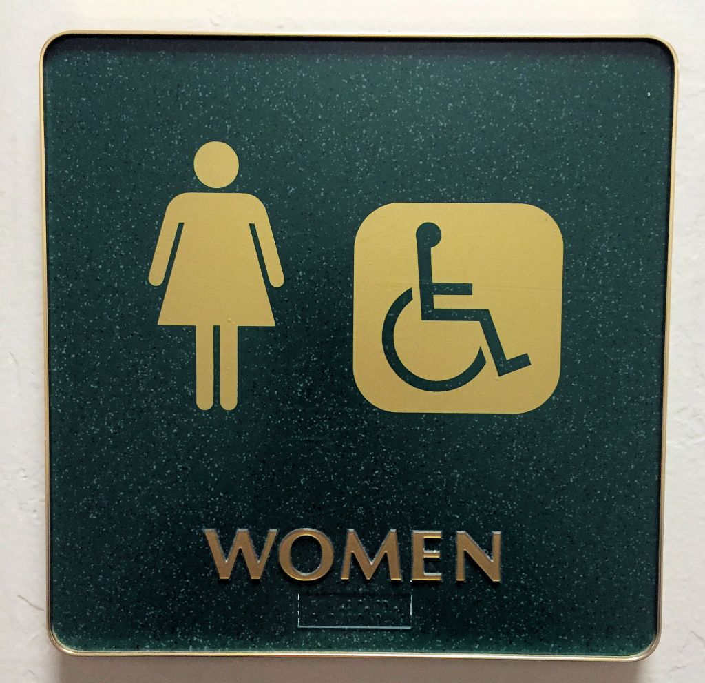 WOMEN- a restroom sign