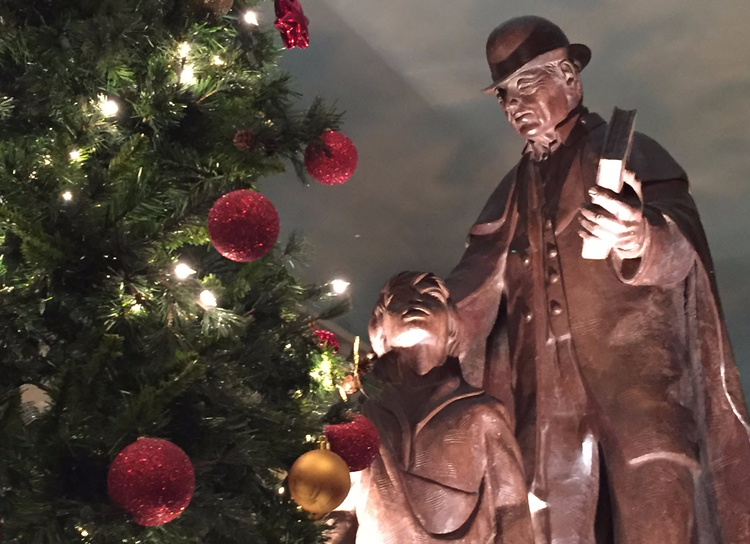 Christmas tree, statues of old man and a boy