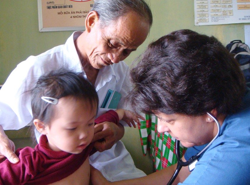 Dr. Aletha treating a child