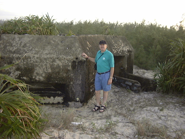 man next to concrete bunker