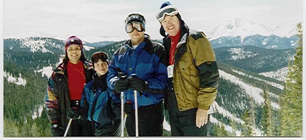 family skiing on mountain