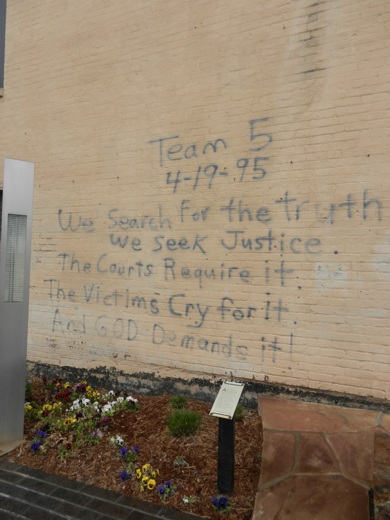 "We search for the Truth" written on a wall.