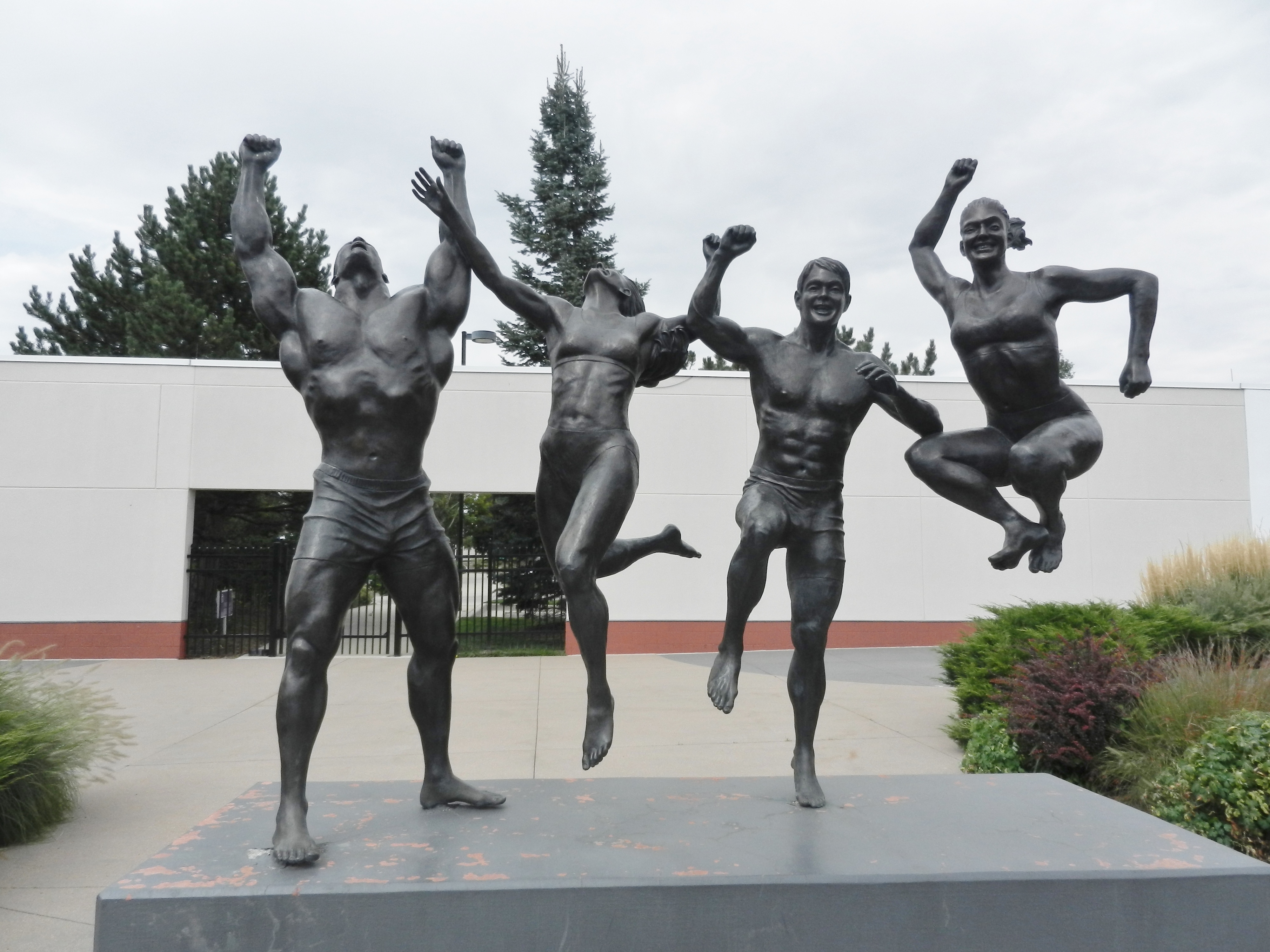 statues of athletes jumping 
