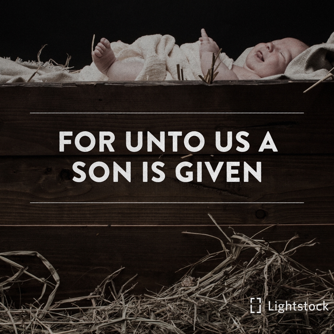 "For unto us a son is given" baby lying in a manger