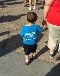 little boy walking with mother, holding hands