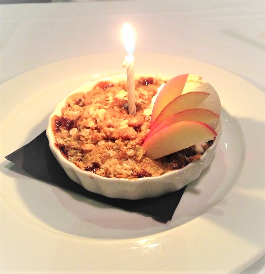 dessert with a lit candle in the middle