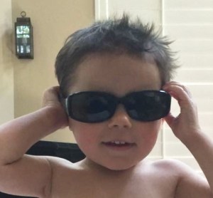 little boy wearing sunglasses