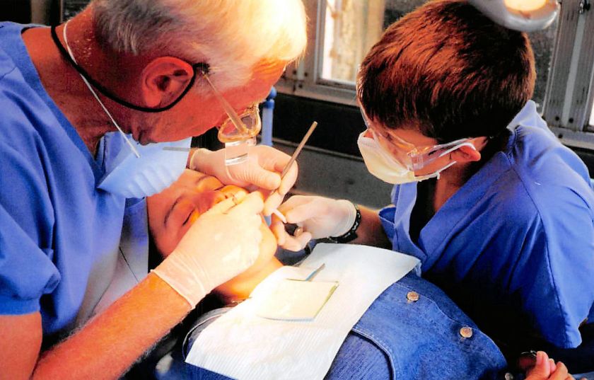 a dentist treating a patient