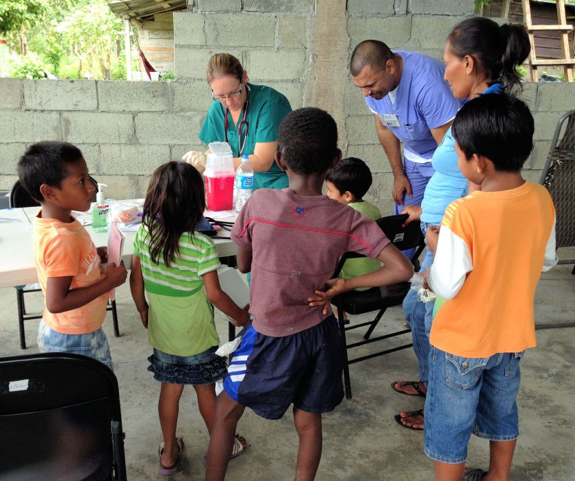 nurse with kids at a rural clinic in Panama
