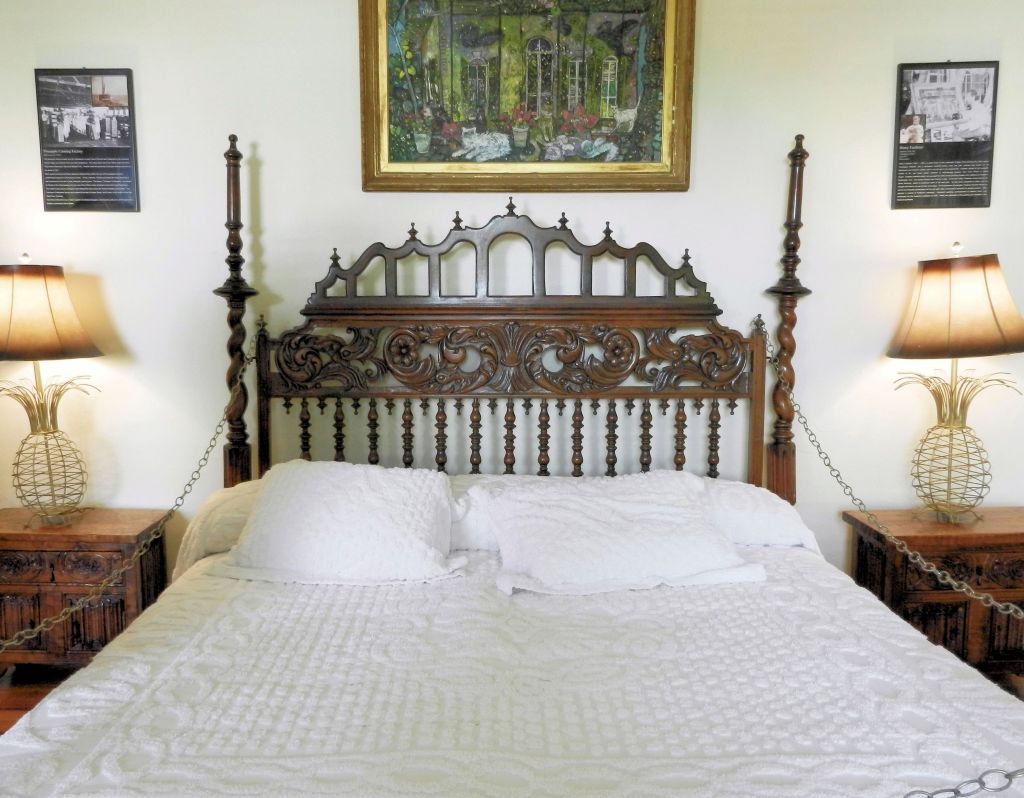 a bed with ornate headboard