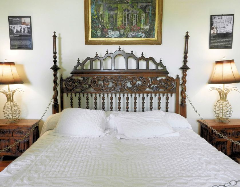 a bed with ornate headboard