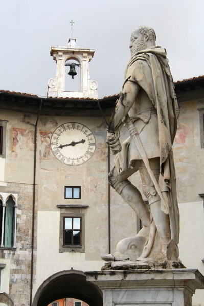 statue of an ancient soldier with an old clock