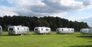 Airstream travel trailers parked at a campground