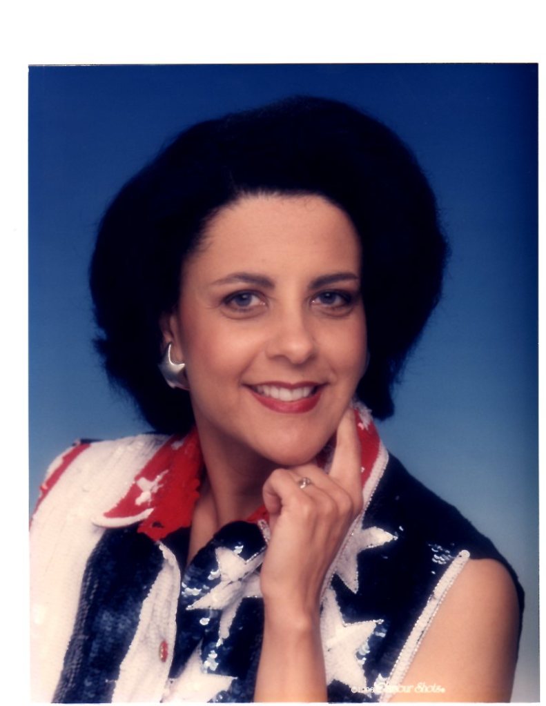 a woman in a red, white, and blue shirt