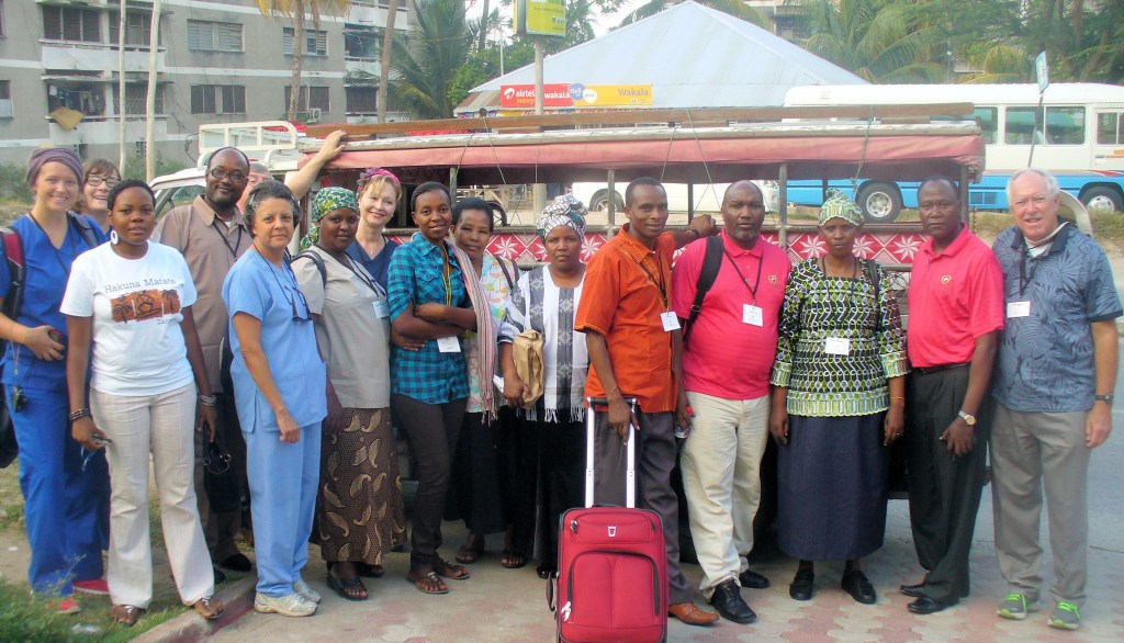 group of people, some in African garb