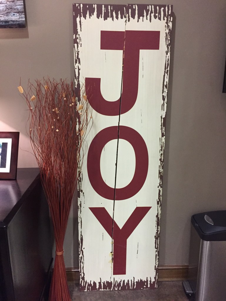 JOY-letters painted on a white board