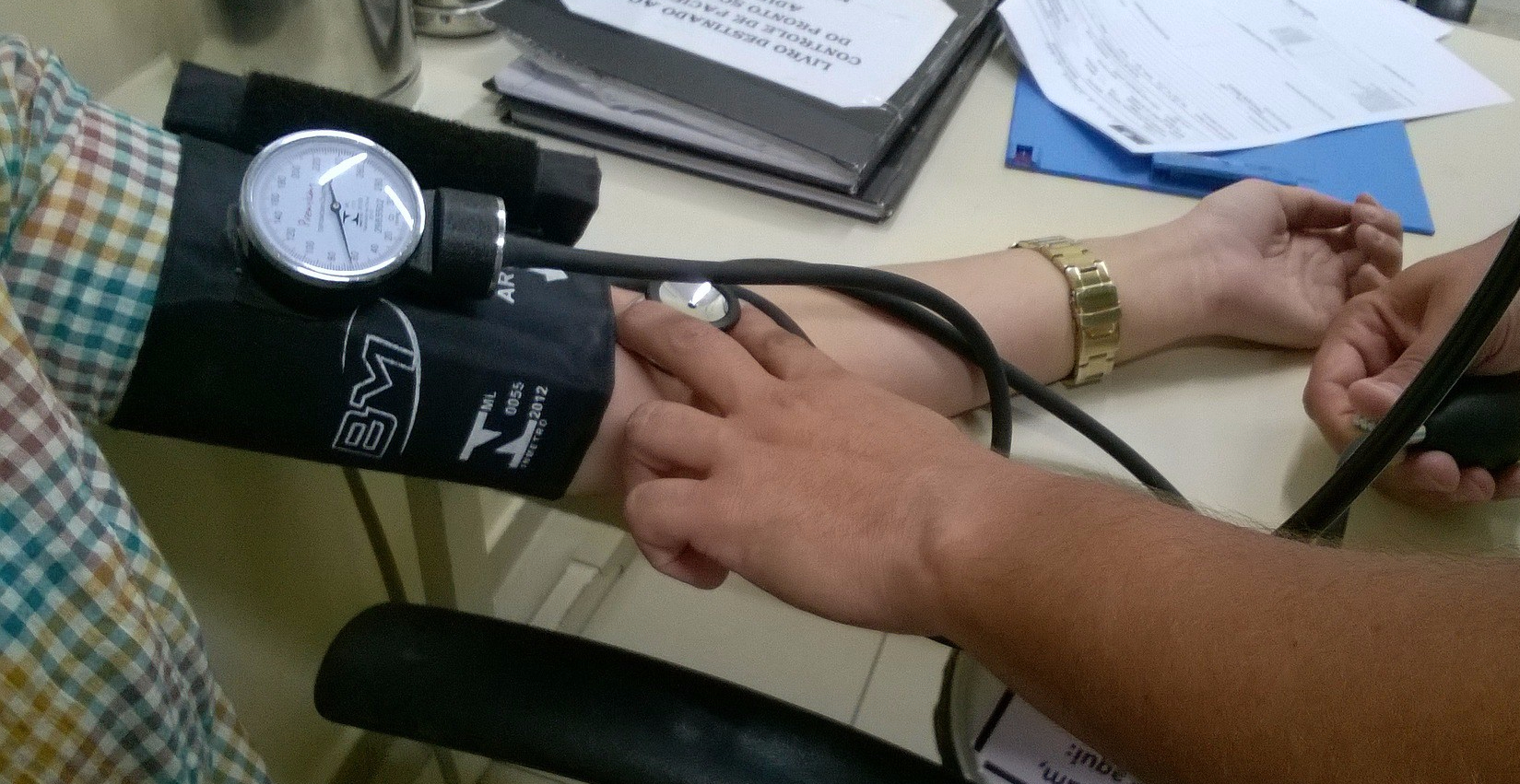 a person having blood pressure measured