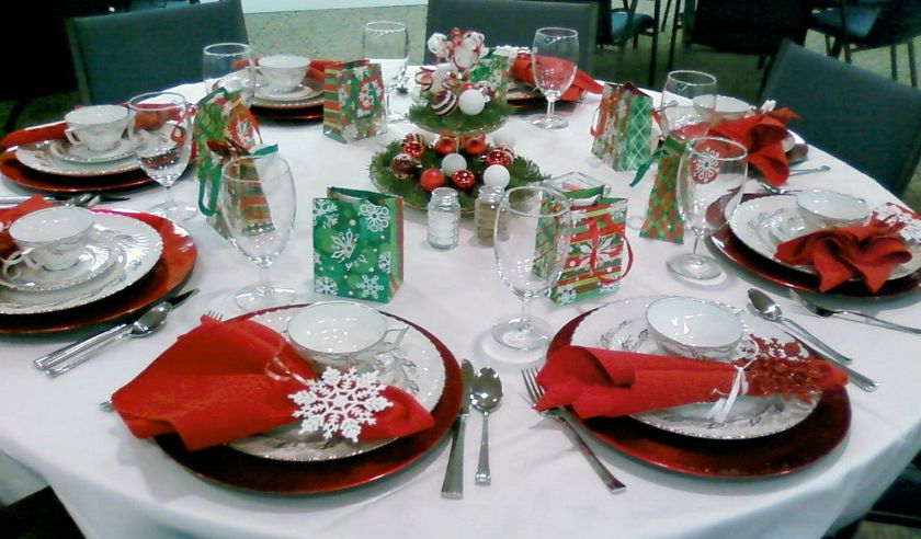 a dining table decorated for Christmas