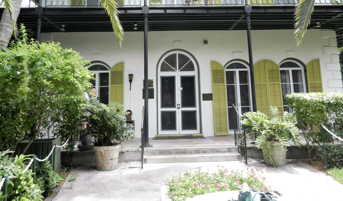 a white house with green shutters-Ernest Hemingway's Key West house