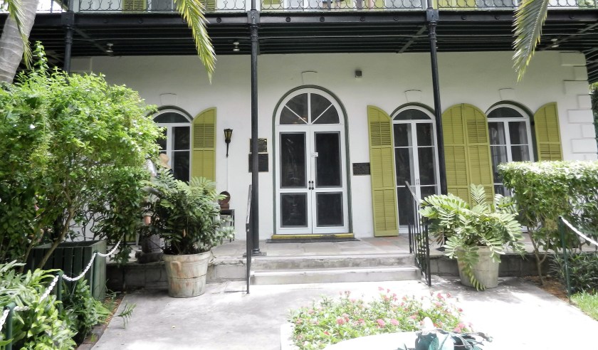 a white house with green shutters-Ernest Hemingway's Key West house
