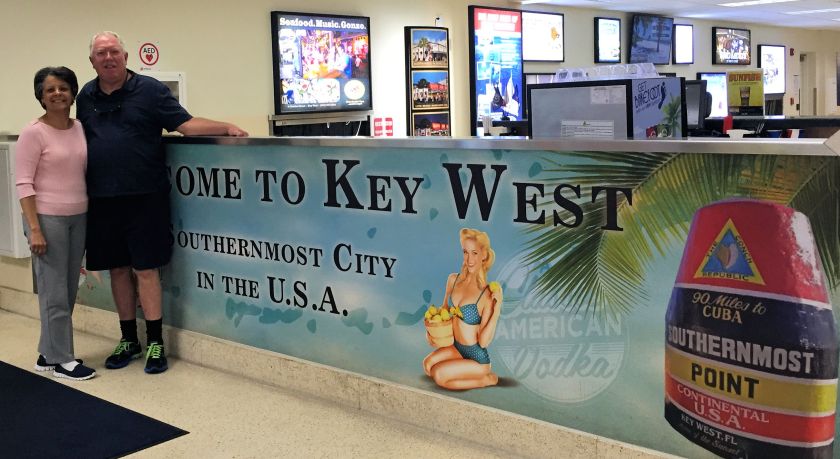 man and woman with Key West visitor sign