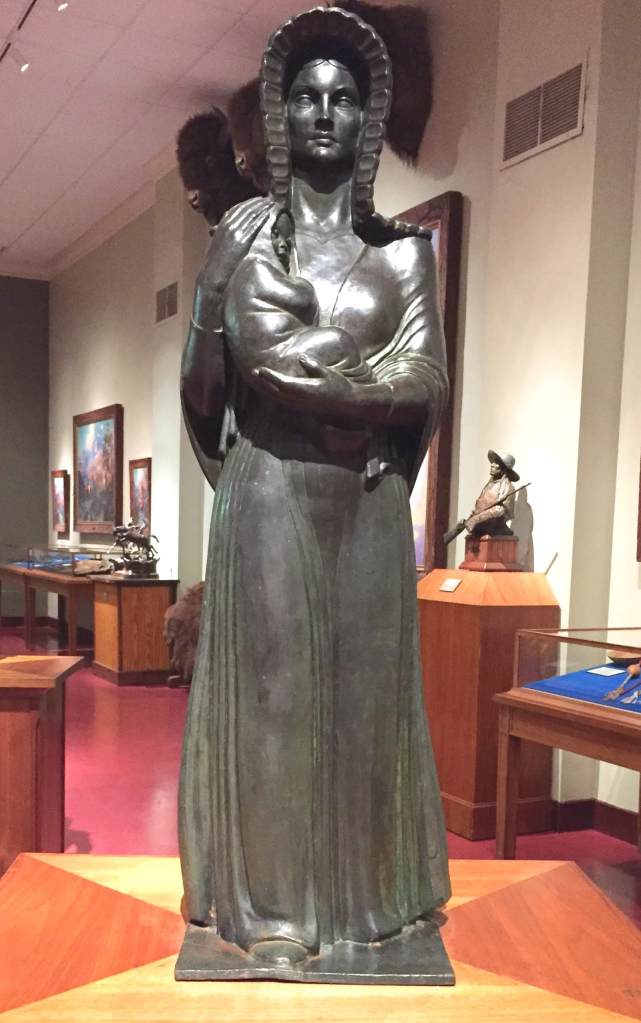 statue of a woman holding an infant