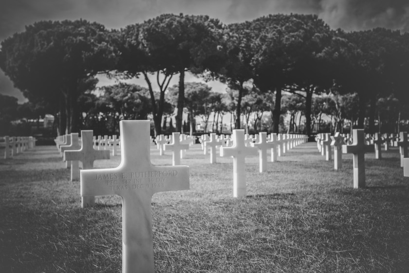 simple cross grave markers in a cemetery
