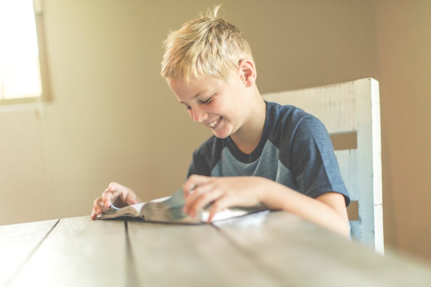 boy reading a book