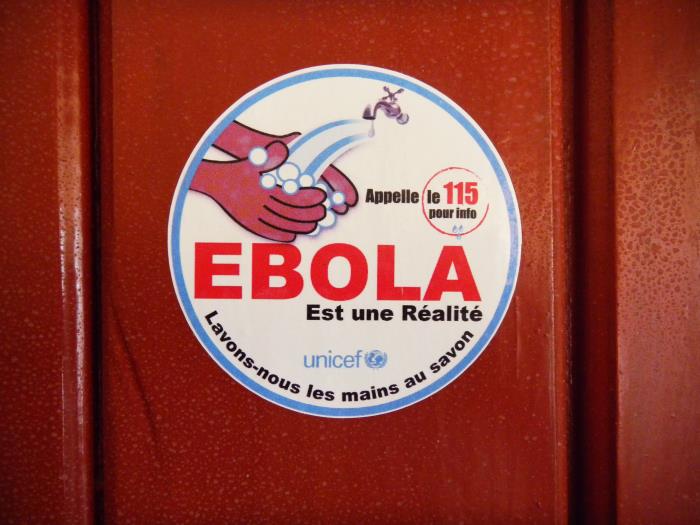 sign which says EBOLA, "wash hands with soap"