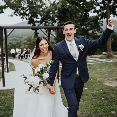 a bride and groom smiling and laughing