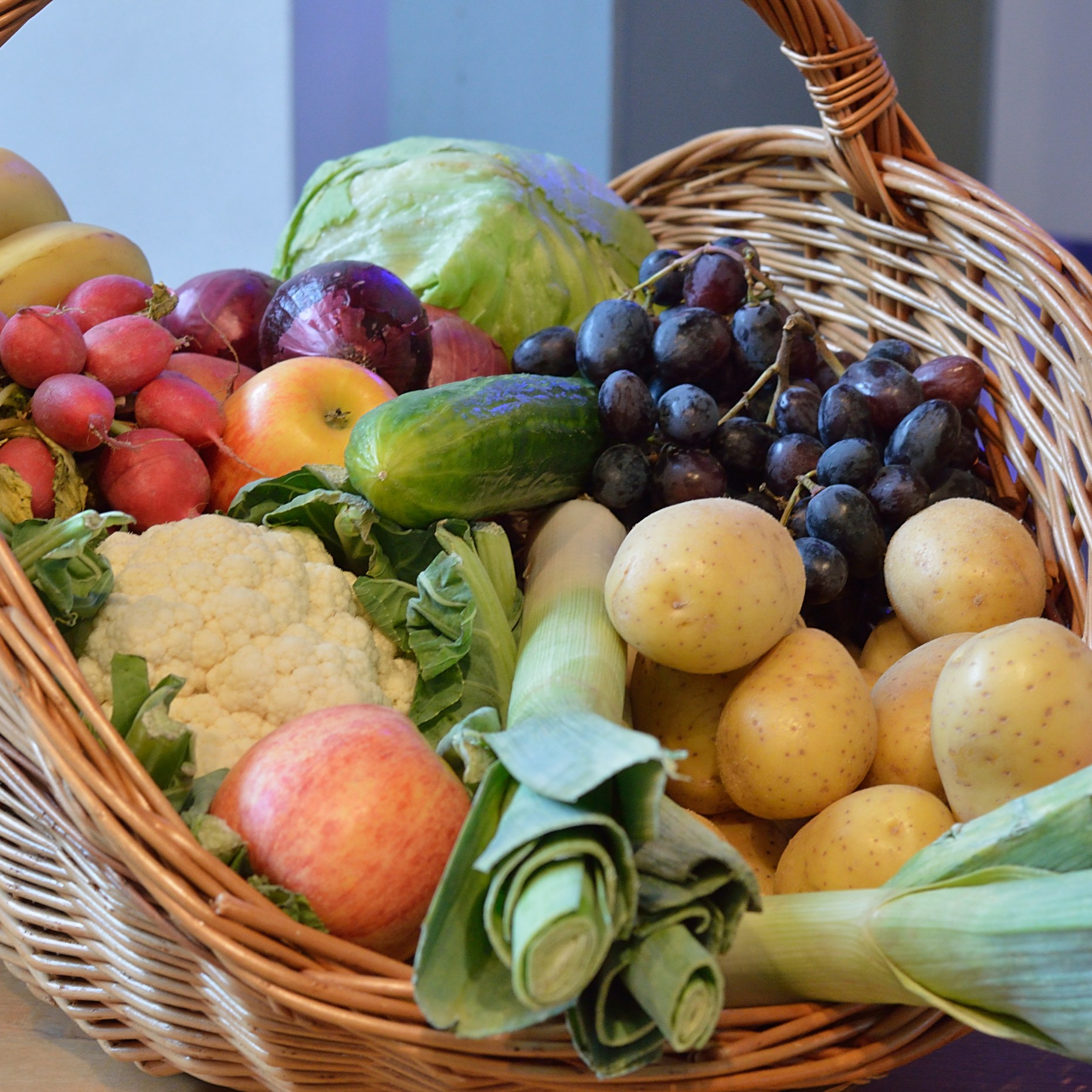 a basket filled with fruits and vegetables