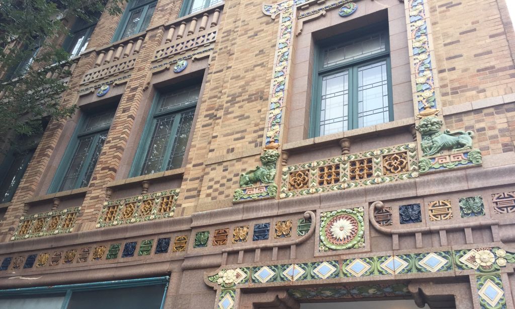 a brick building decorated with Chinese art