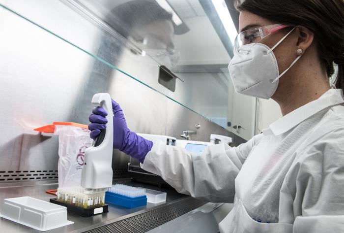 a scientist in a lab working on covid antibodies
