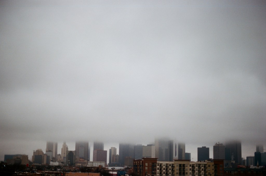 tops of skyscrapers obscured by smog